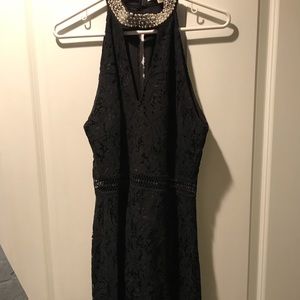 Short black dress with beaded collar